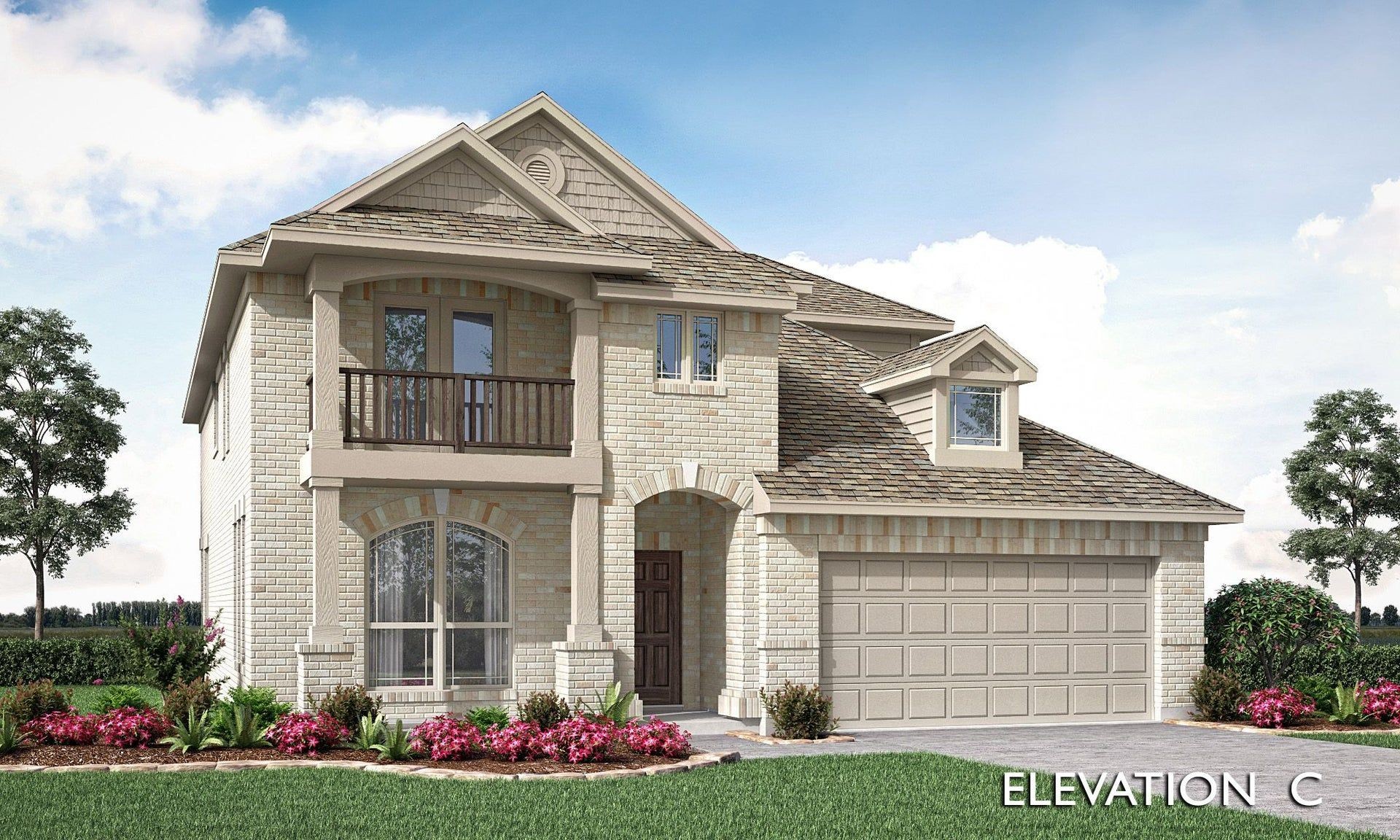 Two-story brick house with a balcony and landscaped front yard under a blue sky.